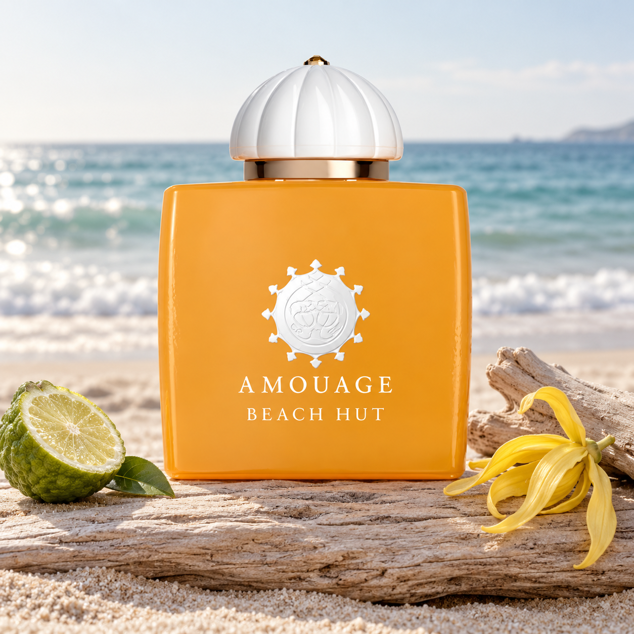Amouage Beach Hut Woman’s orange bottle on sun-bleached driftwood beside bergamot and yellow ylang-ylang, overlooking a quiet beach.