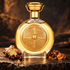 Boadicea the Victorious Defender bottle with ginger, red berries and golden resin on dark stone in warm amber light.