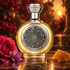 Boadicea the Victorious Ardent on dark stone beside a deep pink rose, purple saffron crocus, and golden honeycomb, illuminated by warm evening light.