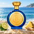 Boadicea the Victorious Azrak’s blue-and-gold bottle on limestone beside bergamot, pineapple, and sandalwood overlooking sunlit blue water.