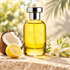 Bois 1920 Aethereus beside coconut, lemon, and white tuberose on pale limestone in soft tropical sunlight.