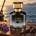 Byron Parfums Barba Rossa on a wooden ship deck beside violets, vanilla pods, and oud wood, overlooking a golden-lit sea.