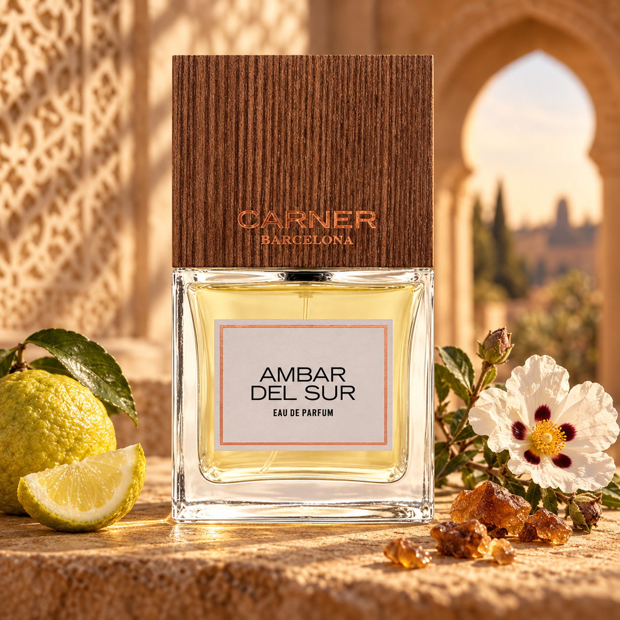Carner Barcelona Ambar del Sur stands beside bergamot, cistus flowers, and myrrh resin in warm light beneath a Moorish arch.