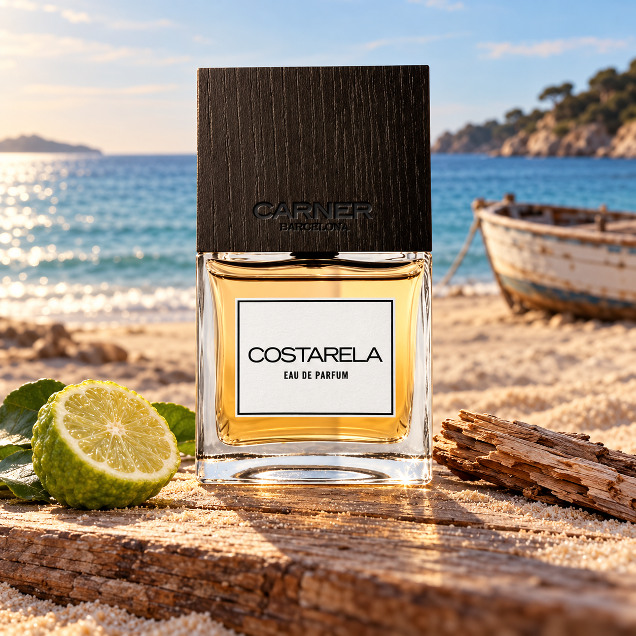 Carner Barcelona Costarela bottle beside bergamot and weathered wood on a sandy Mediterranean shore, with an old rowboat in the background.