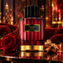 Carolina Herrera Burning Rose with a red rose, cinnamon, and ginger in a warmly lit vintage lounge.