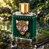 Carolina Herrera CH Beasts on wet stone beside a forest pool, with juniper berries, fir sprigs, and vanilla pods in dappled sunlight.