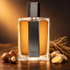 Caron Aimez-Moi Comme Je Suis beside hazelnuts, sliced ginger, and vetiver roots on dark wood under warm amber lighting.