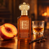 Clive Christian E Gourmand Oriental with a peach half, rum glass, vanilla pod, and cloves on dark wood in warm amber light.