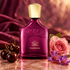 Creed Carmina with dark cherries, a pink rose, and purple saffron crocuses on rose marble against burgundy silk in warm light.
