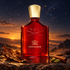 Creed Centaurus beside tobacco leaf, cinnamon, and cardamom on dark stone beneath a starry sky and glowing amber horizon.