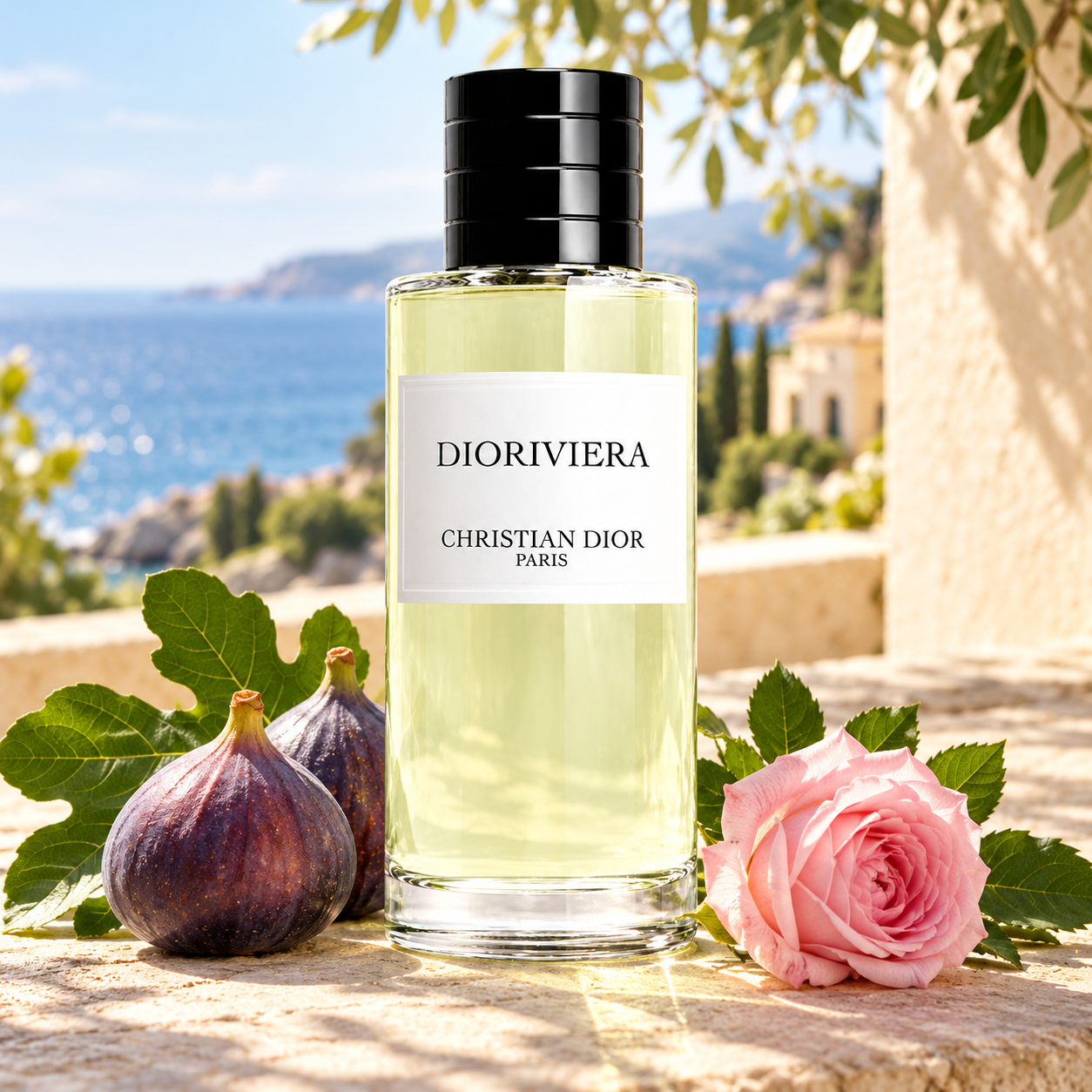 Dior Dioriviera bottle with whole purple figs, fig leaves and a pink rose on a sunlit terrace overlooking the Riviera.