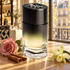 Diptyque 34 Boulevard Saint-Germain Eau de Parfum with a pink rose, cinnamon, and vanilla orchid on a sunlit Parisian boutique counter.