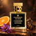 Fragrance Du Bois Cannabis Intense beside an orange half, purple saffron crocuses, and dark wood in warm amber light.
