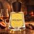 Frapin Bonne Chauffe with a plum half, cognac glass, and charred oak on a rustic table beside a warm hearth.