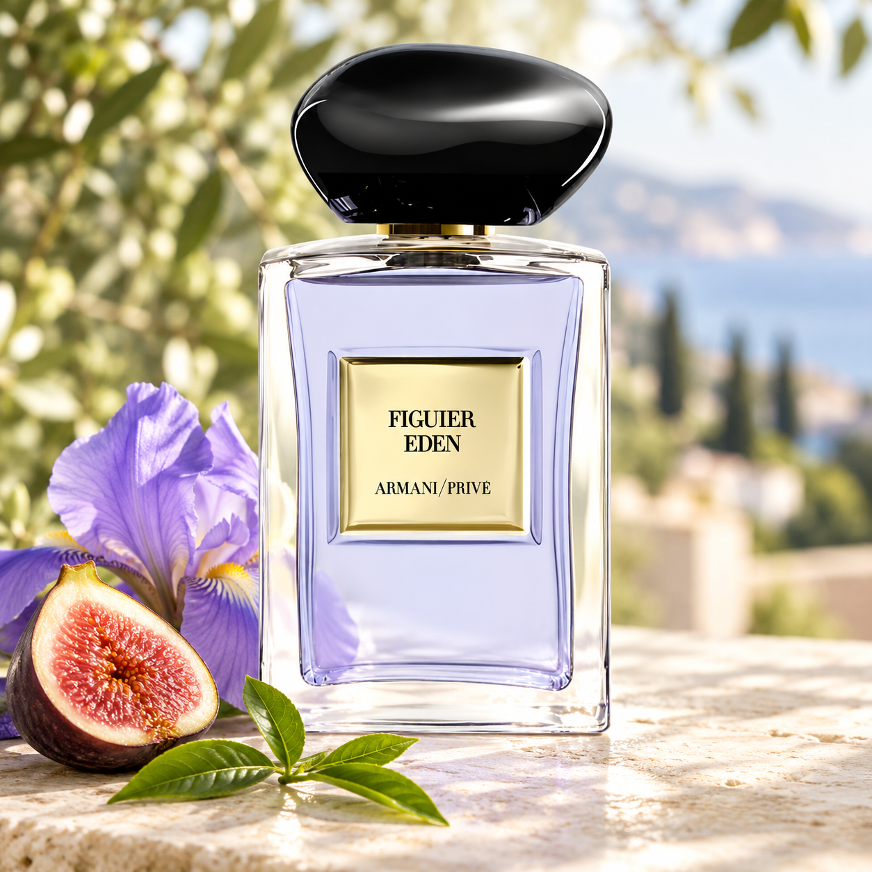 Giorgio Armani Figuier Eden on sunlit pale stone with a cut fig, purple iris and fresh tea leaves against a softly blurred Mediterranean landscape.
