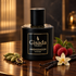 Gisada Ambassador Intense’s black and gold bottle stands beside cardamom, raspberries, and vanilla pods with a cream orchid in warm amber light.