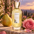 Goutal Ce Soir ou Jamais beside a golden pear and dewy pink rose on a stone ledge overlooking a garden at sunset.