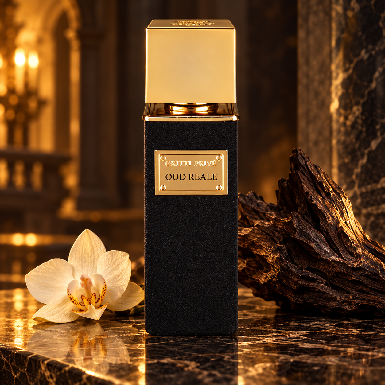 Gritti Oud Reale black and gold perfume bottle with an orchid and dark wood on polished stone in warm golden light.