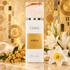 Gritti Adèle surrounded by golden osmanthus, white tuberose, and narcissus on cream silk against a gold mosaic backdrop.