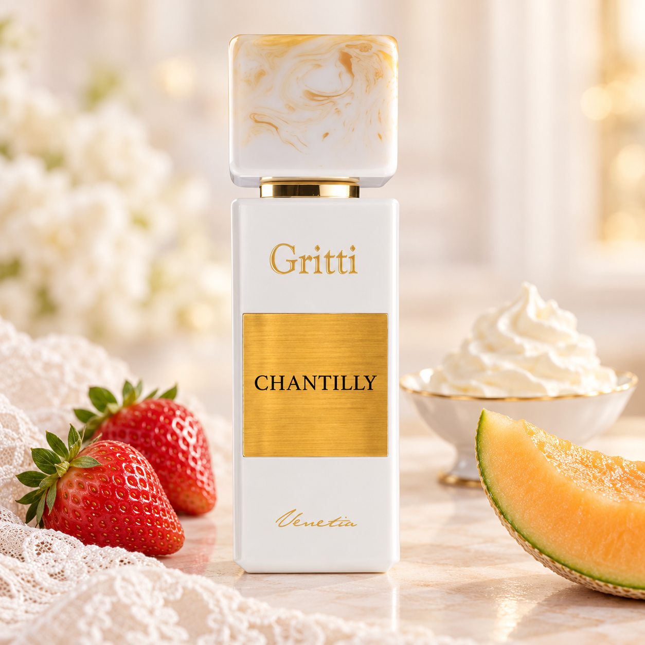Gritti Chantilly beside strawberries, a melon wedge, and whipped cream, with white lace and soft warm lighting.