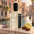 Histoires de Parfums 1725 with lavender, star anise, and citrus beside a sunlit Venetian canal.