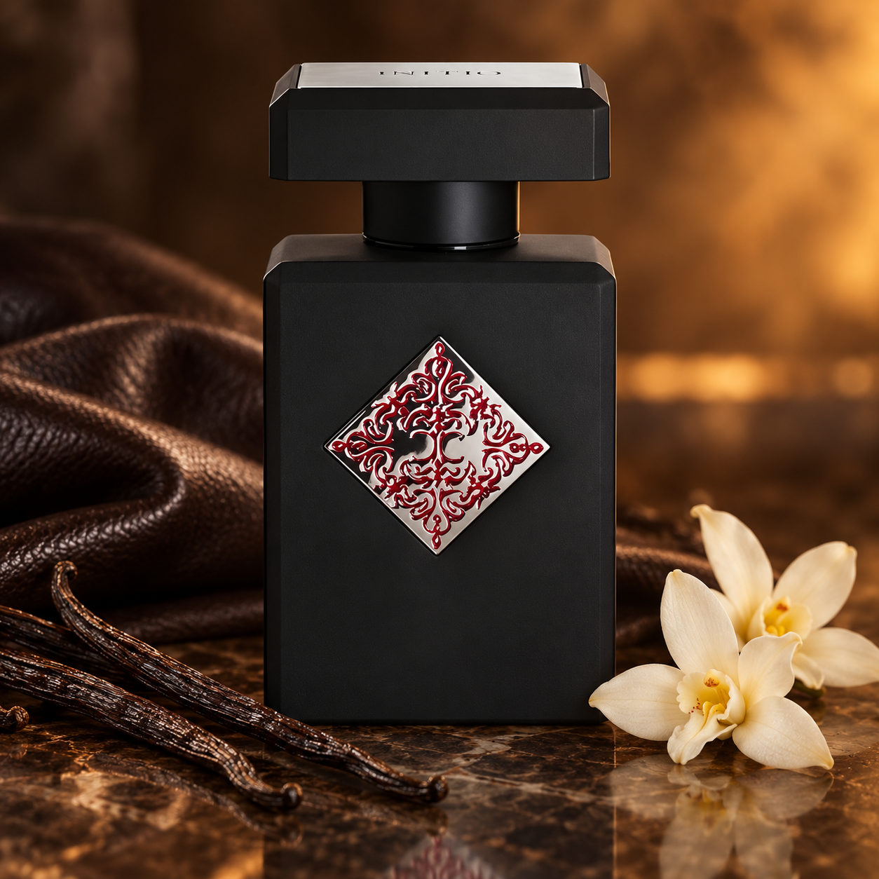 Initio Absolute Aphrodisiac bottle with vanilla pods, white flowers, and dark leather in warm amber lighting.