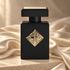 Initio Magnetic Blend 7 on ivory stone, surrounded by champagne silk folds in soft, warm light.