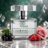 Kajal Almaz’s silver bottle stands beside blackcurrants, raspberries, and a pink rose against an emerald backdrop with prismatic crystal highlights.