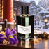 L’Orchestre Parfum Encens Asakusa with purple iris and incense resin on polished wood before a softly lit snowy Japanese temple setting.