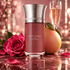 Liquides Imaginaires Dom Rosa Millésimé bottle with a rose, whole pomelo and champagne flute on rose marble in warm light.