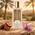 Memo Paris Abu Dhabi beside dates, plum, and saffron flowers on sandstone, with woven fabric and softly blurred oasis palms.