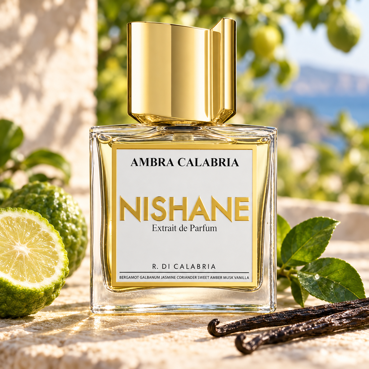 Nishane Ambra Calabria bottle beside bergamot, glossy green leaves, and vanilla pods on pale stone in warm sunlight.