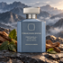 Ormonde Jayne Patchouli d’Atlas bottle with cedarwood and patchouli leaves on slate before misty mountains.