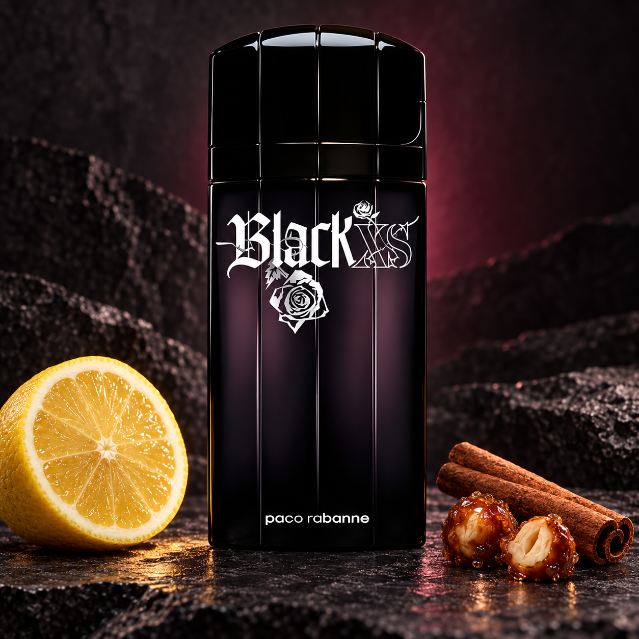 Paco Rabanne Black XS on dark textured stone beside a large lemon slice, cinnamon sticks, and caramelized pralines under muted plum lighting.