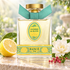 Rancé 1795 Alchimie du Matin beside lemon, a dewy white gardenia, and pink pepper berries on pale stone in soft morning light.