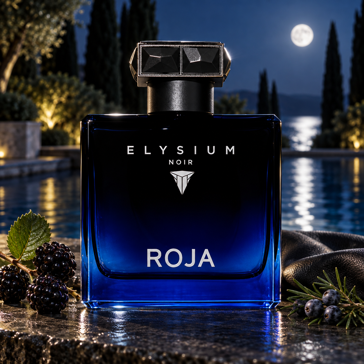 Roja Elysium Noir beside blackberries, juniper berries, and folded black leather on dark stone, overlooking a moonlit pool framed by cypress trees.