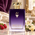 Purple Roja 51 bottle on a marble vanity with raspberries, white lilies, jasmine, and a vanilla orchid in warm light.