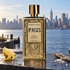 Rosendo Mateu 1988 gold bottle with lemon, sea salt, and driftwood overlooking the Manhattan waterfront in soft morning light.