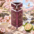State of Mind Butterfly Mind beside cherry blossoms, white tea, and cut feijoa, with a butterfly above a sunlit stream.