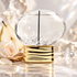 The House of Oud Pure Diamond with pear, a pale rose, sandalwood, and crystal accents in soft ivory light.