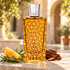 The Merchant of Venice Esperidi Water with orange, rosemary and cedarwood on pale stone in a sunlit courtyard.