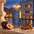 The Merchant of Venice Arabesque beside plum, cinnamon sticks, and tobacco leaf on Venetian stone, overlooking a canal and Gothic palace at twilight.
Bottle reference: Fragrantica.