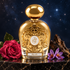 Tiziana Terenzi Alioth’s ornate golden bottle stands on black marble beside a deep pink rose, purple saffron crocuses, and oud wood against a starry navy backdrop.