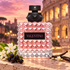 Valentino Donna Born In Roma pink bottle with jasmine, blackcurrants and vanilla on travertine overlooking Rome at dusk.