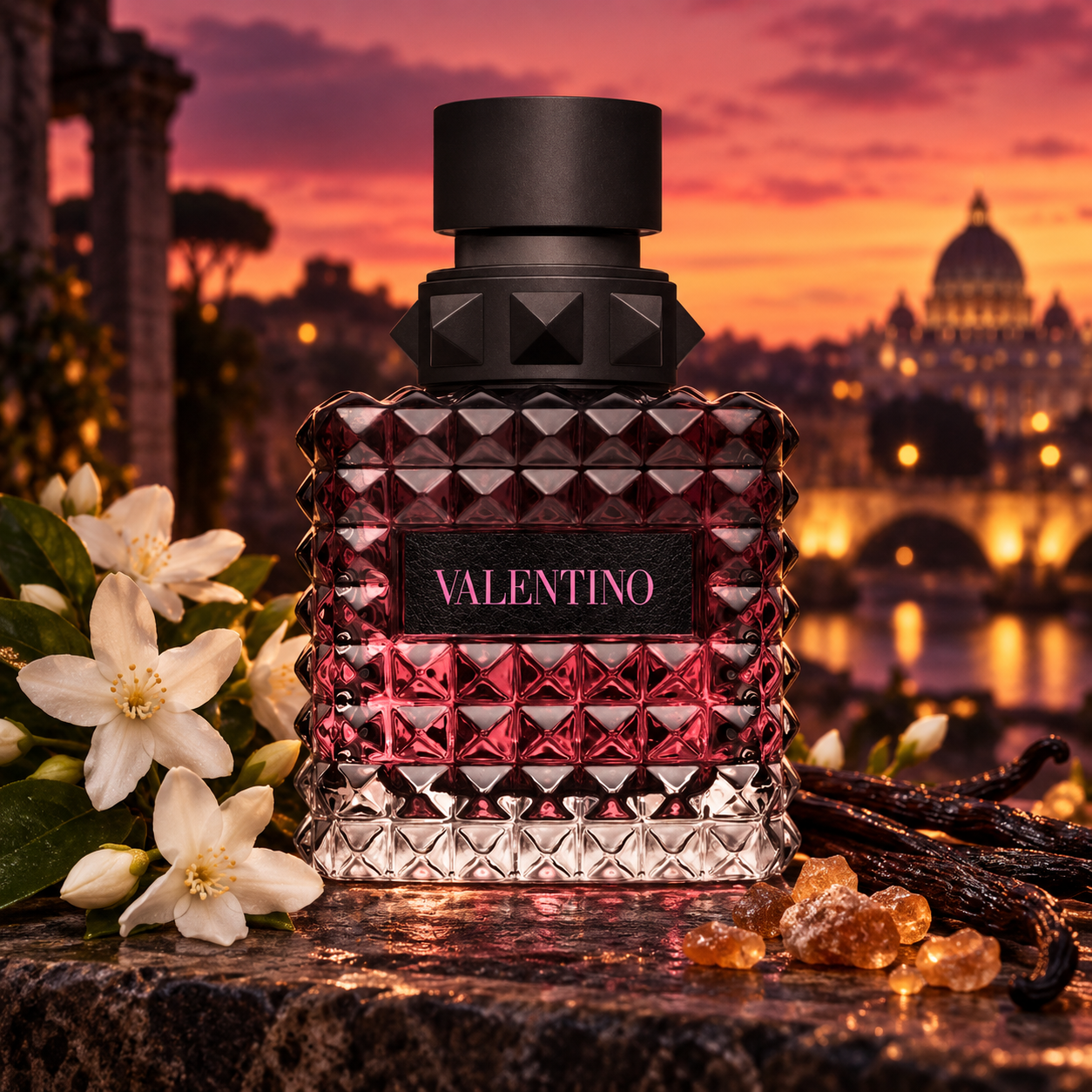 Valentino Donna Born In Roma Intense bottle with jasmine, vanilla and benzoin on dark stone above Rome at sunset.