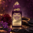 Stéphane Humbert Lucas Crying of Evil purple and gold perfume bottle with violets, a burgundy rose and black leather on dark slate.