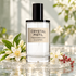 D.S. & Durga Crystal Pistil bottle on frosted glass above rippling water, beside dewy orange blossoms, jasmine and pink peppercorns in soft daylight.