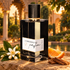 L'Orchestre Flamenco Neroli with orange blossom, an orange wedge and cedar on stone in a golden-lit Seville garden.