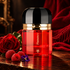 Ramon Monegal Flamenco with a red rose, raspberries and a violet on dark wood beside red fabric.