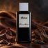 Franck Boclet Crime black perfume bottle with dark chocolate, tonka beans and wood on brown leather in warm side lighting.